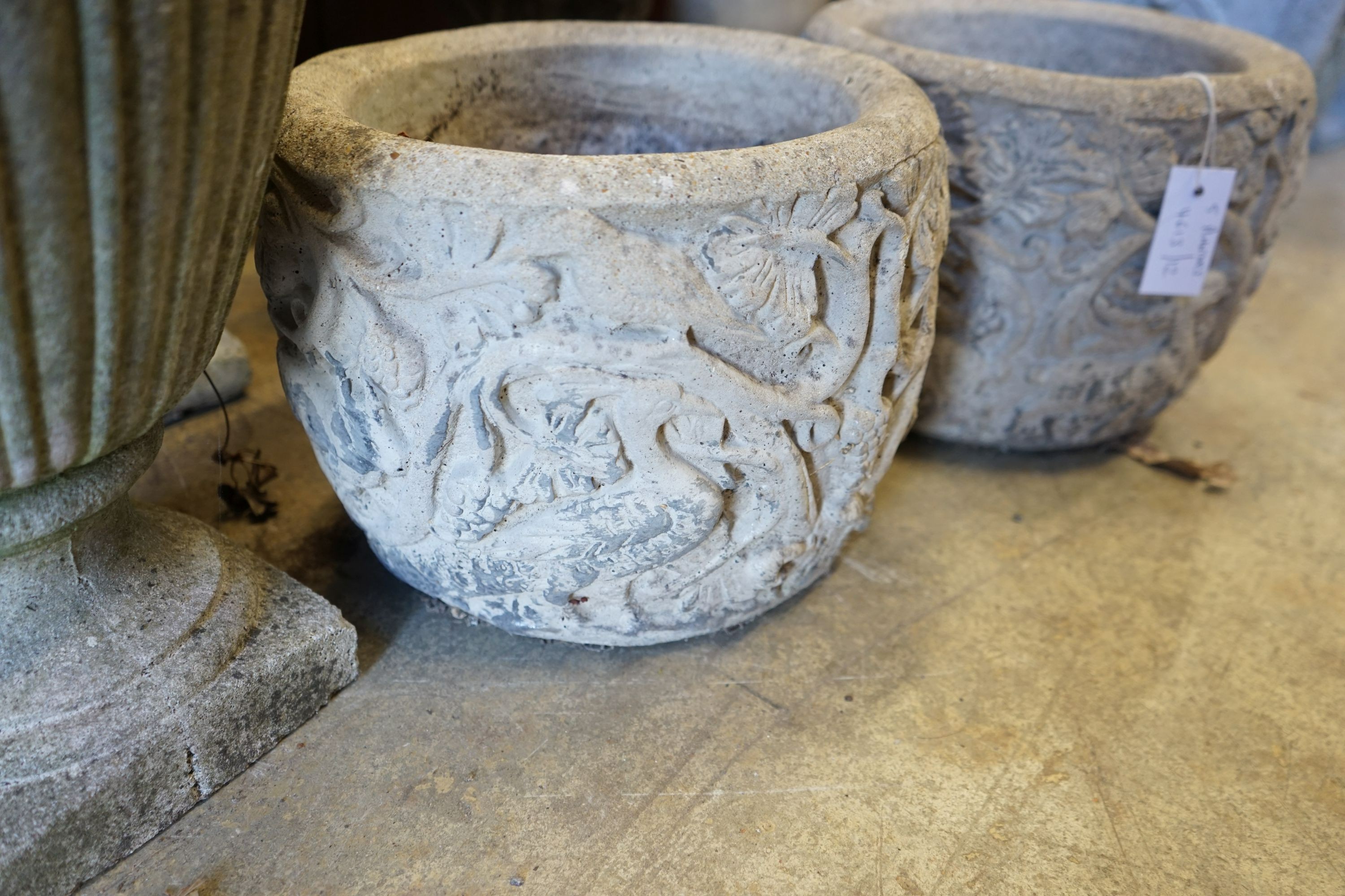 Five circular reconstituted stone garden planters, largest diameter 40cm, height 46cm